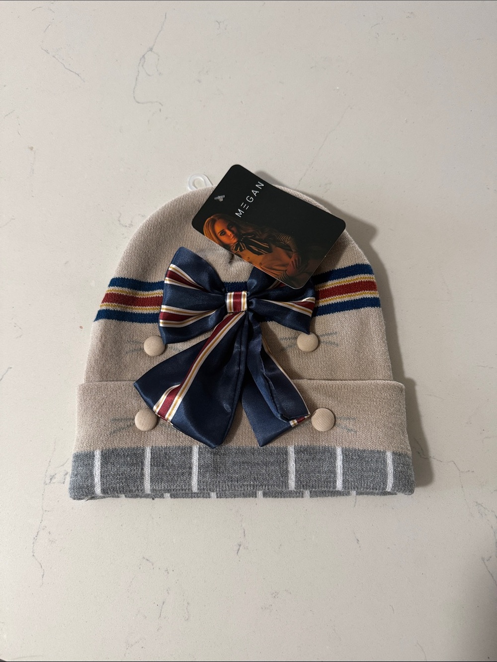 Universal Studios Megan Beige Knit Beanie with Navy Striped Bow